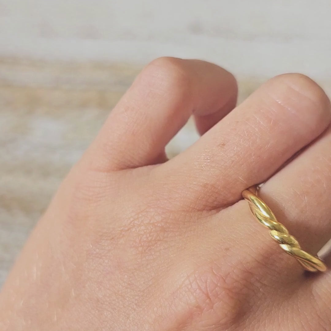 wrapped gold plated ring on hand
