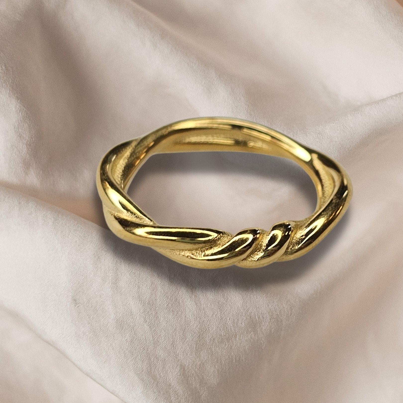 twisted gold plated ring on sheet